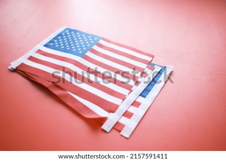 American flag on red background top view 