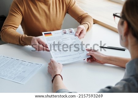 Man Applying For Visa At Office Royalty-Free Stock Photo #2157593269