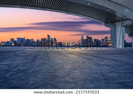 Empty asphalt road and modern city skyline with buildings in Hangzhou at sunset, China. Royalty-Free Stock Photo #2157595033