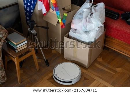 boxes with things to move, military uniform and flag of America