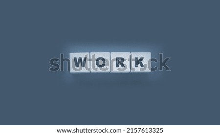 Inscription on wooden cubes Work on black The concept of working from home.