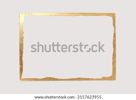 Gold (bronze) glitter empty frame on beige gray paper background. Abstract copy space texture. Royalty-Free Stock Photo #2157623955