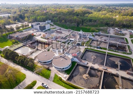 Modern urban wastewater treatment plant. Water purification plant, automatic process of removing chemicals, solids and gases from contaminated water. Water cleaning facility outdoors. Aerial view. Royalty-Free Stock Photo #2157688723