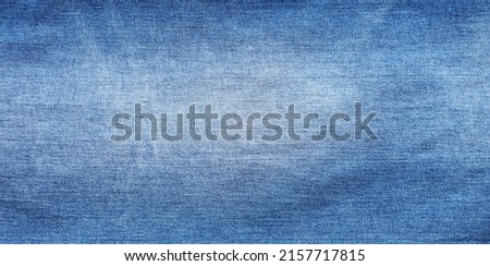 Close-up of blue denim jeans fabric texture background Royalty-Free Stock Photo #2157717815