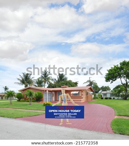 Mannequin wearing tie holding For Sale Sign in driveway of suburban style ranch house in residential neighborhood Blue Sky Clouds
