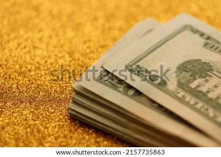 Big amount of old twenty dollar bills on golden background. Money earnings, payday or tax paying period concept
