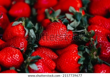Close-up of a selective focus of ripe strawberries on the counter. Strawberries are sold in boxes as a healthy food. Top view of delicious, fresh, juicy strawberries, just picked. Juicy berries. Royalty-Free Stock Photo #2157739677