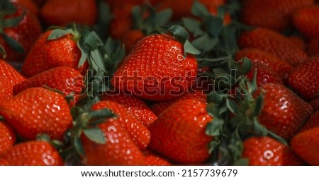 Close-up of a selective focus of ripe strawberries on the counter. Strawberries are sold in boxes as a healthy food. Top view of delicious, fresh, juicy strawberries, just picked. Juicy berries. Royalty-Free Stock Photo #2157739679