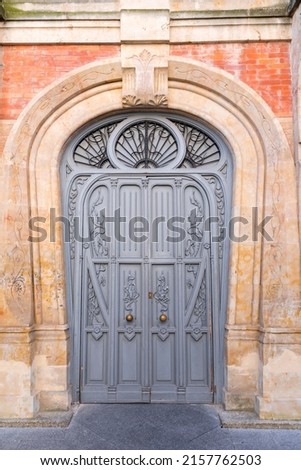 Old and beautiful art nouveau styleornate door, classic architectural detail. Royalty-Free Stock Photo #2157762503
