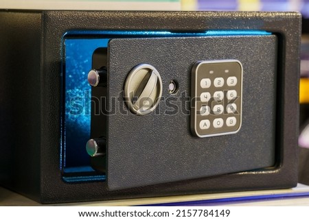 Safe for storing valuables or firearms. Background with copy space for text or lettering. Royalty-Free Stock Photo #2157784149