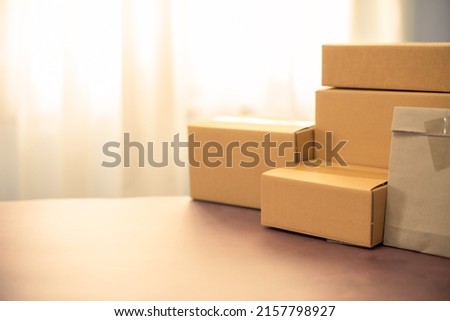 Lot of brown cardboard boxes copy space on table warehouse delivery service shipment goods. cardboard parcel box of product for deliver to customer. Online selling, e-commerce, packing concept. Royalty-Free Stock Photo #2157798927