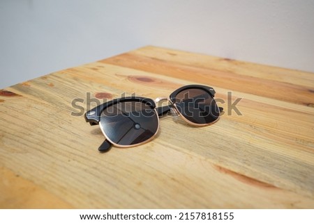 sunglasses. Glasses on a wooden background.