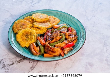 Chopped steak or Bistec Picao and patacones or tostones are fried green plantain slices, made with green plantains, Typical latin food, Panamá, Central America