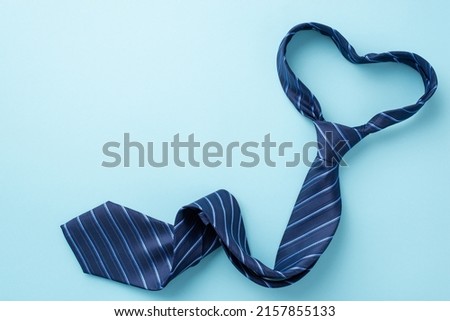 Father's Day concept. Top view photo of heart shaped blue necktie on isolated pastel blue background with copyspace Royalty-Free Stock Photo #2157855133