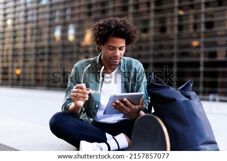 Man buying online with a credit card and a digital tablet. 