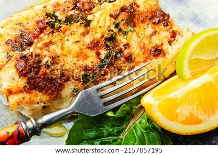 Fish fillet fried in orange oil, fish dish