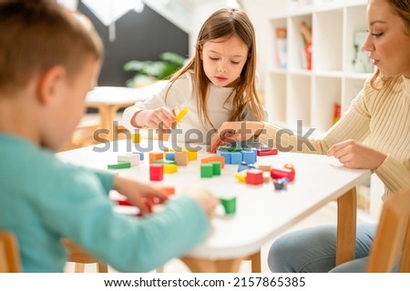 Children eating a fruit snack in a kindergarten  Royalty-Free Stock Photo #2157865385