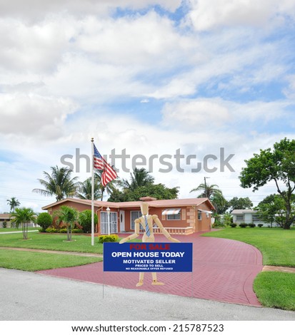 American Flag Pole Mannequin wearing tie holding for sale sign on brick driveway of suburban home in residential neighborhood blue sky clouds USA