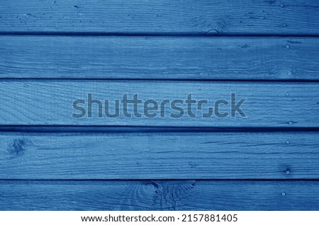 Old grungy wooden planks background in navy blue color. Abstract background and texture for design.                      