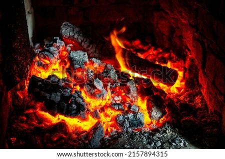 Hot coals in the fire. Coals in the sauna stove. Royalty-Free Stock Photo #2157894315