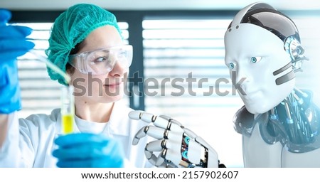 Scientits working in a modern lab with a humanoid robot. Royalty-Free Stock Photo #2157902607