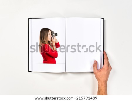 Girl taking a picture printed on book
