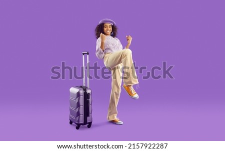 YES, finally. Kid with suitcase very excited about going on vacation. Full body length happy cute tourist girl having fun in studio with purple background. Traveling, holidays, children concept Royalty-Free Stock Photo #2157922287