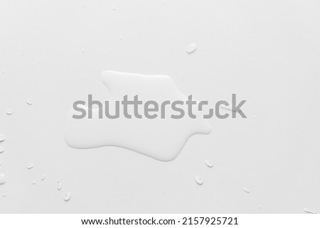 
Water spilled on a white table