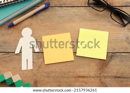 Top view image of wooden office table and empty notes