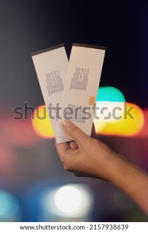 Date night starts here. Shot of an unrecognizable person holding up two tickets. Royalty-Free Stock Photo #2157938639