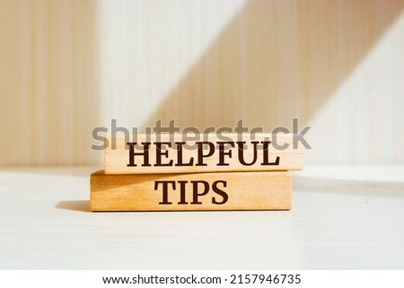 Wooden blocks with words 'Helpful tips'.