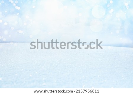 BLUE SNOW BACKGROUND, BLUE CHRISTMAS BACKDROP, WINTER SNOWY LANDSCAPE WITH EMPTY SPACE FOR MONTAGE PRODUCTS AND CHRISTMAS PRESENTS, LIGHT FROSTY TEXTURE