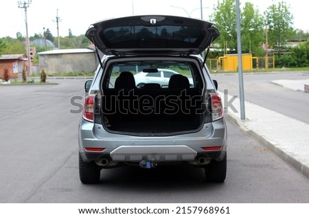 Modern SUV open trunk. Modern car with open empty trunk. Modern wagon car open trunk. Car boot is open.  Royalty-Free Stock Photo #2157968961