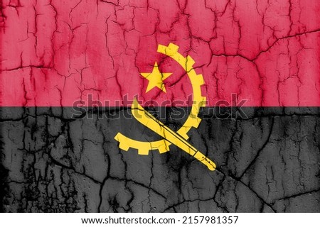 Textured photo of the flag of Angola with cracks.