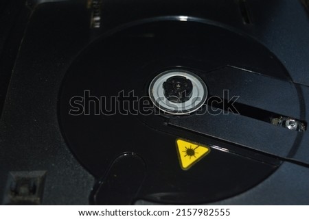 mechanical compact disc is a place to read a circular disk made of metal and read by an optic Royalty-Free Stock Photo #2157982555
