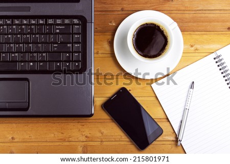 Laptop, Smartphone and coffee on wooden background