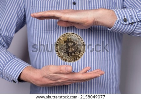 Bitcoin coin flying between man hands. Cryptocurrency, virtual money concept in abstract style. Blockchain technology, stock market. High quality photo