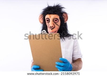 Person dressed in overalls with a mask, wearing a medical nurse outfit, holding a folder, on white background. Monkeypox, pandemic, virus, epidemic, Nigeria and smallpox concept.