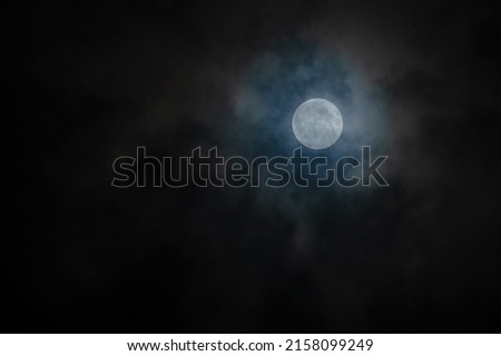 ฺBeautiful full moon picture of the night sky cloudy background and the bright night sky with a beautiful full moon