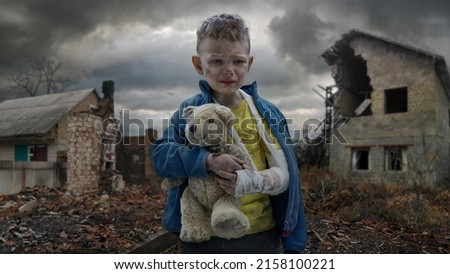 Scared little boy crying. Little Ukrainian patriot. No war with Ukraine. Royalty-Free Stock Photo #2158100221