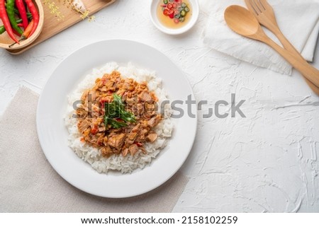 Stir Fried Canned Tuna with Thai Basil and Cook Jasmine Rice in white plate.asian food.Top view Royalty-Free Stock Photo #2158102259