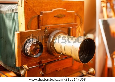 An old format camera with two lenses in a photography museum. Old school camera.