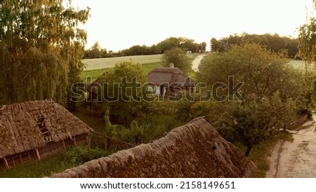 Several village houses in the forest. Aerial photography of small village during daytime.