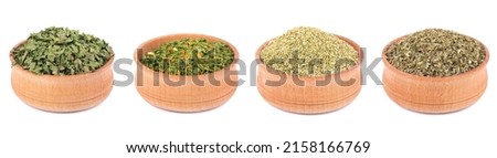 Mix of spices and seasonings isolated in wooden bowl, isolated on white background. Dry organic herbs. Ingredient for cooking Royalty-Free Stock Photo #2158166769