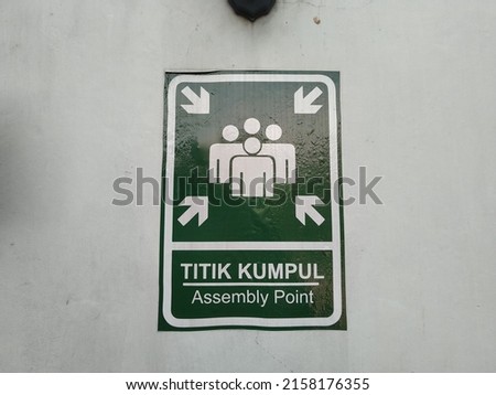 Evacuation route assembly point sign