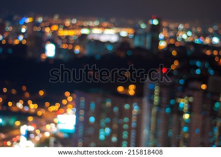 Blur image of Kuala Lumpur city with star shape bokeh