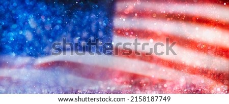 Sparkling red, white, and blue abstract background. USA background or American flag wallpaper for 4th of July, Memorial Day, Veteran's Day, or other patriotic celebration.