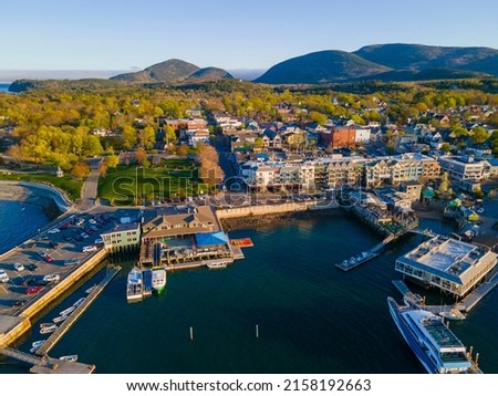 Bar Harbor historic town center aerial view at sunset, with Cadillac Mountain in Acadia National Park at the background, Bar Harbor, Maine ME, USA.  Royalty-Free Stock Photo #2158192663