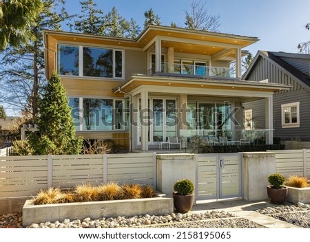 Luxury house in Vancouver, Canada. Big luxury house with a patio in a sunny day. Selective focus, nobody.