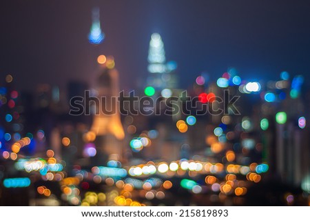 Blur image of Kuala Lumpur city with circle bokeh